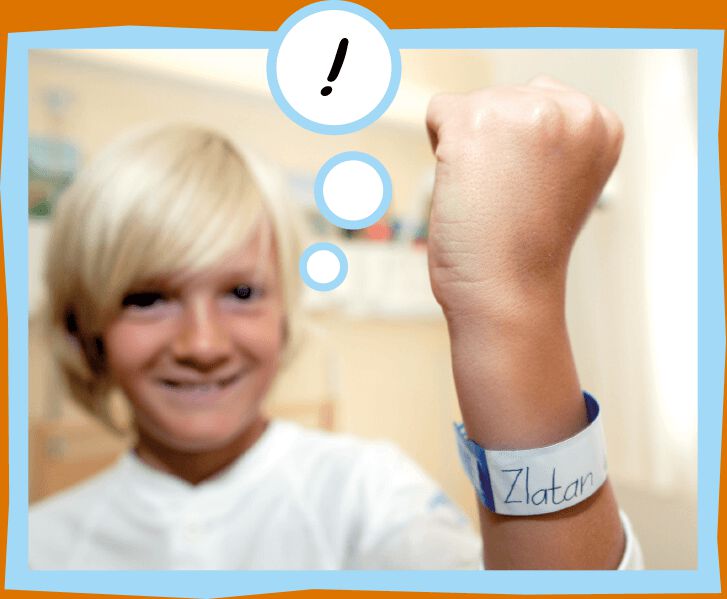 Lucas shows his hospital bracelet with the name Zlatan on it.