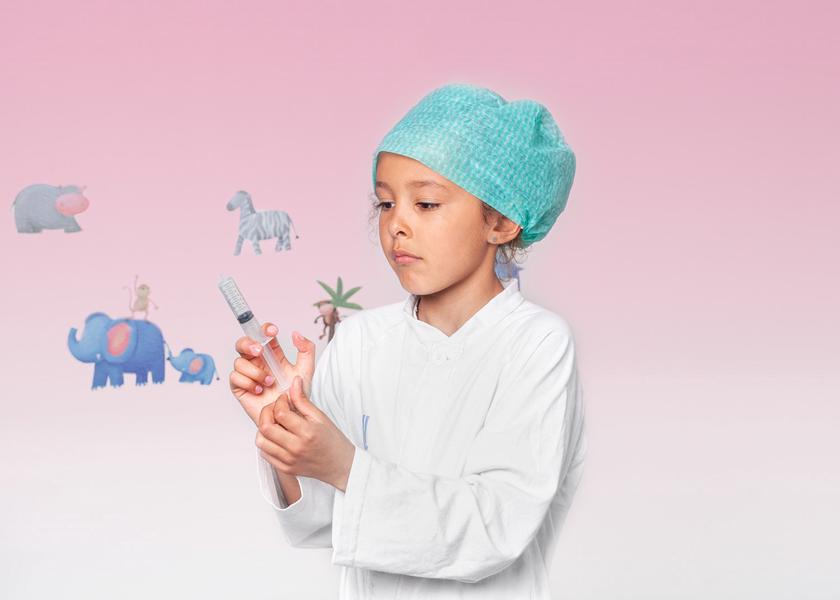 Girl in a green hat is holding a syringe in her hand.