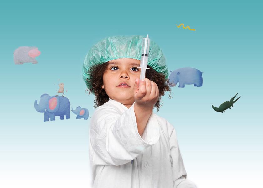 Girl holding a syringe in her hand. She is pointing the syringe upward.
